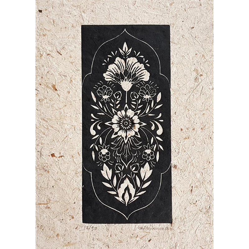 Linocut print of a folksy floral pattern in black