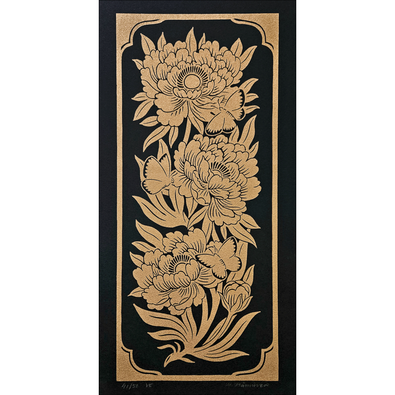 Linocut print with golden flowers and butterflies on black paper
