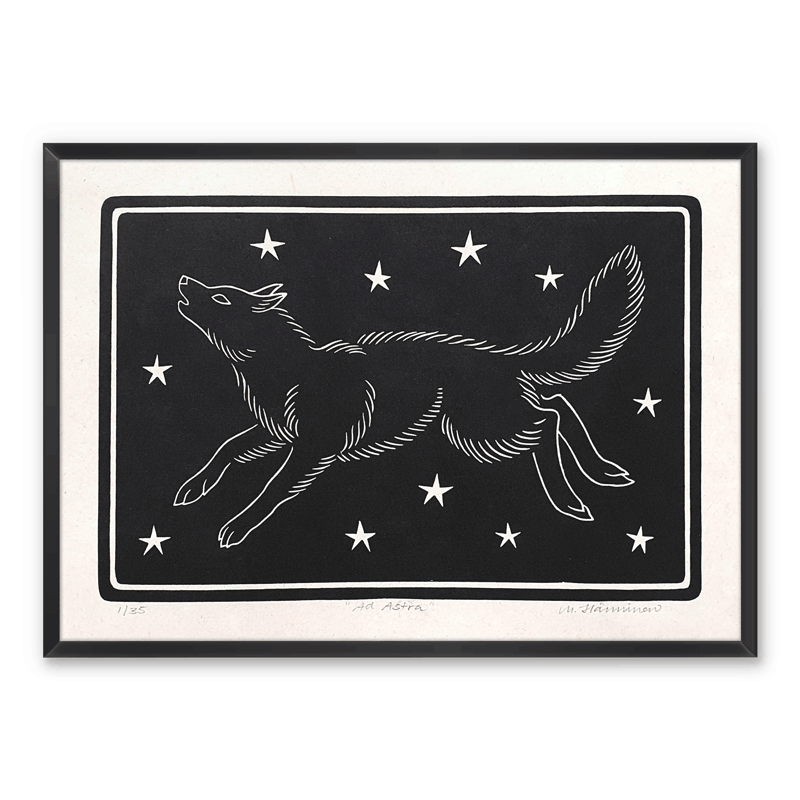 Handmade art print of a howling wolf running across starry sky, framed on a wall