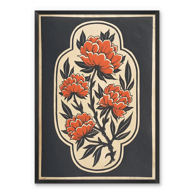 Linocut print of red flowers and black border, framed on white wall