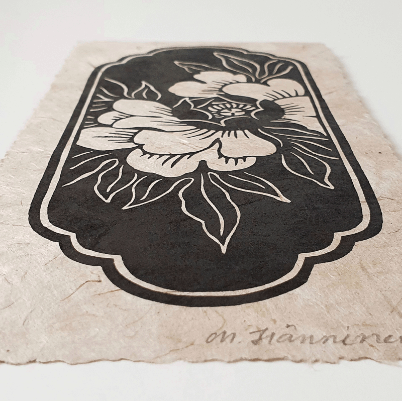 Sideview of a handmade peony linocut print