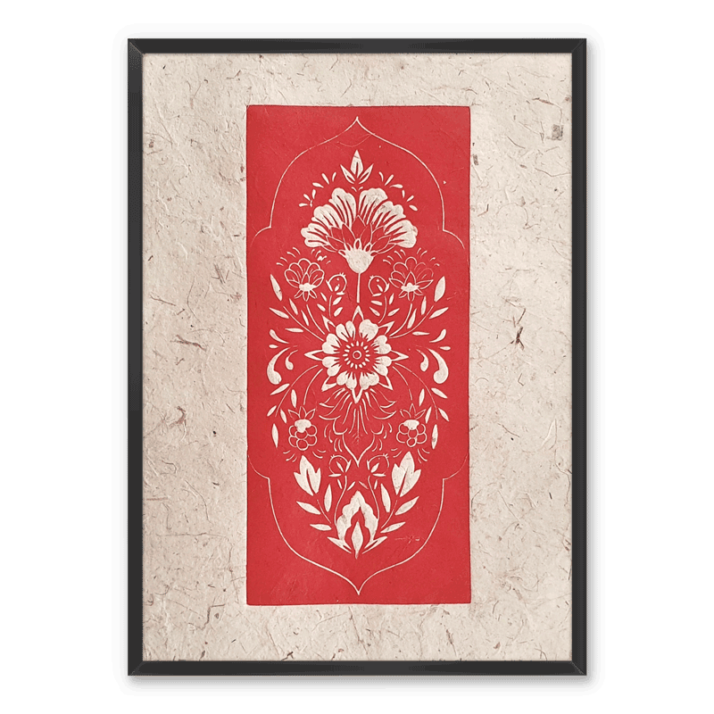 A framed linocut print of a red folk art inspired floral pattern