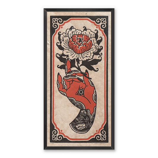 A red and black linocut print of a hand holding a peony flower