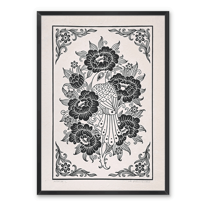 Framed bird linocut print on a white wall