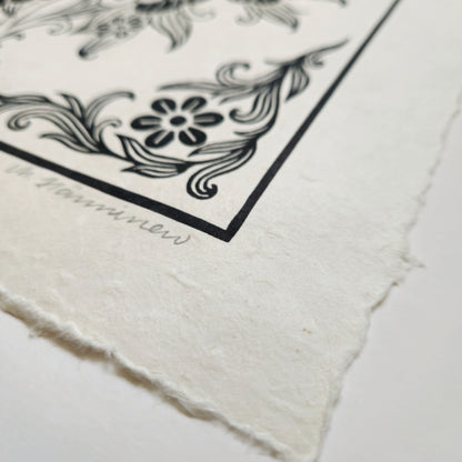 Detail of a linocut print deckle edge and handmade paper