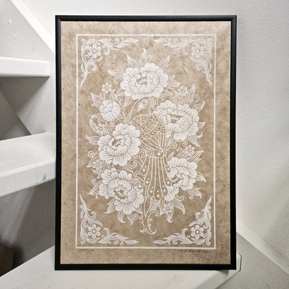 Framed linocut print of a bird and peony flowers printed in white on unbleached paper