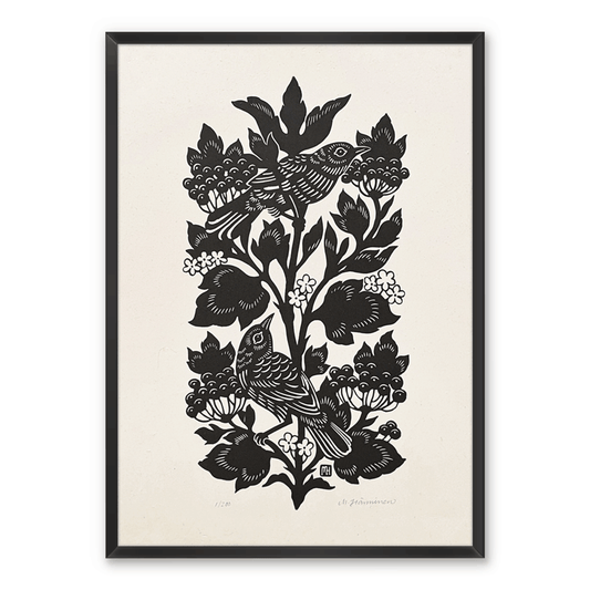 A black and white linocut print of two nightingales and guelder rose plant  framed on white wall