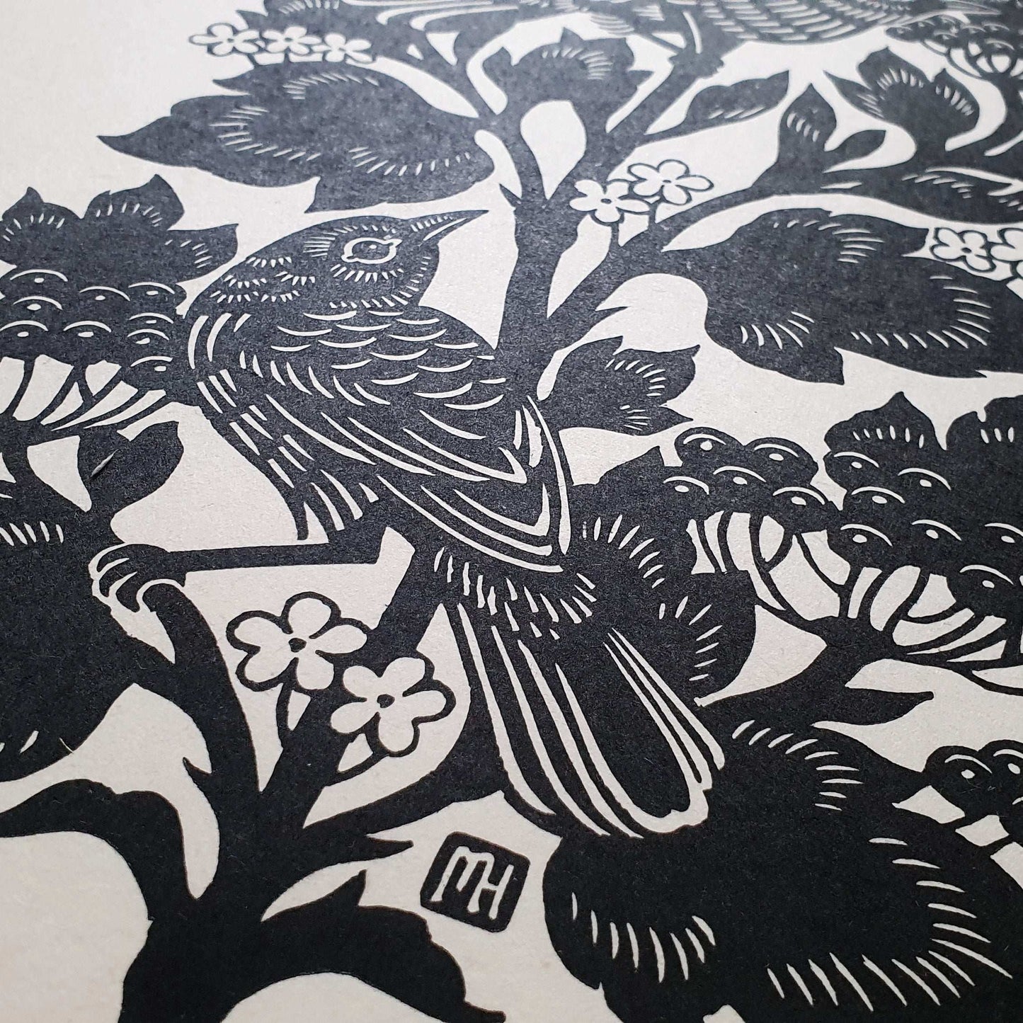 Linocut print detail of a bird looking up
