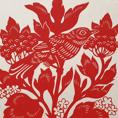 Closeup shot of a red bird linocut pint