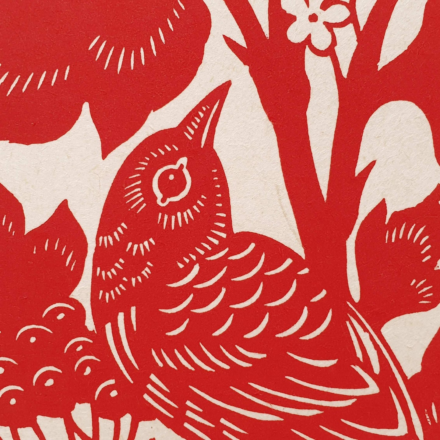 Detail of a handprinted bird linocut