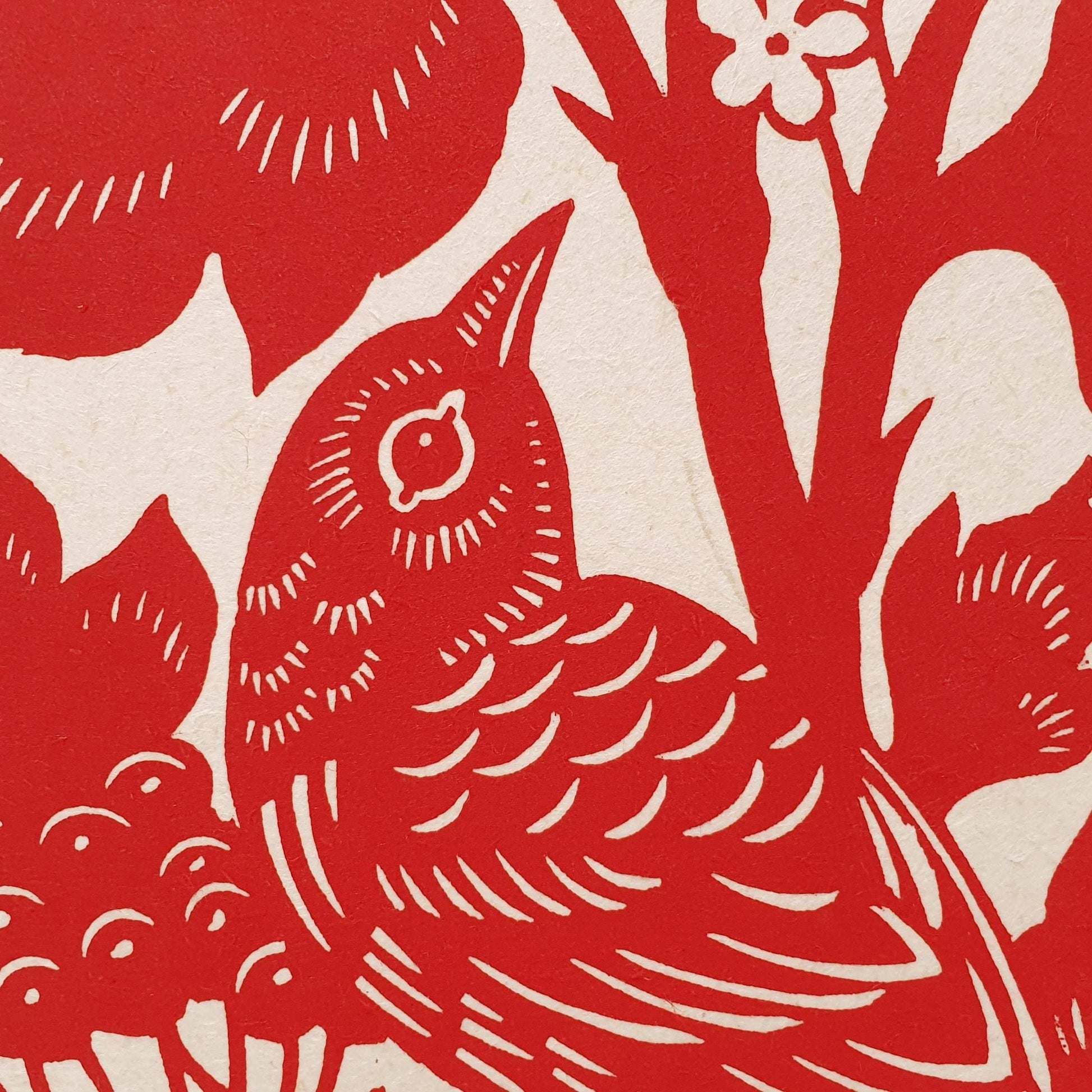 Detail of a handprinted bird linocut