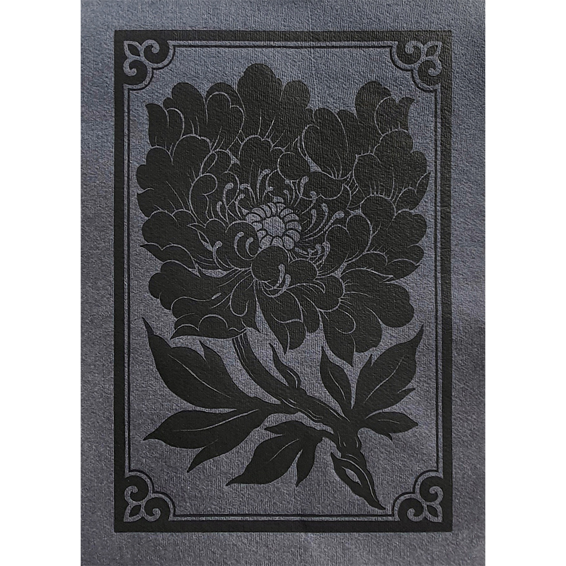 Linocut print of a lush peony flower on slate paper