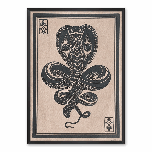 Linocut print of a stylized black cobra, famed on white wall