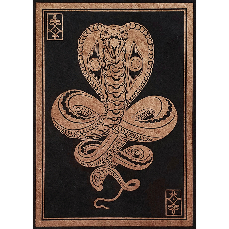 Handmade art print of a copper cobra on black paper