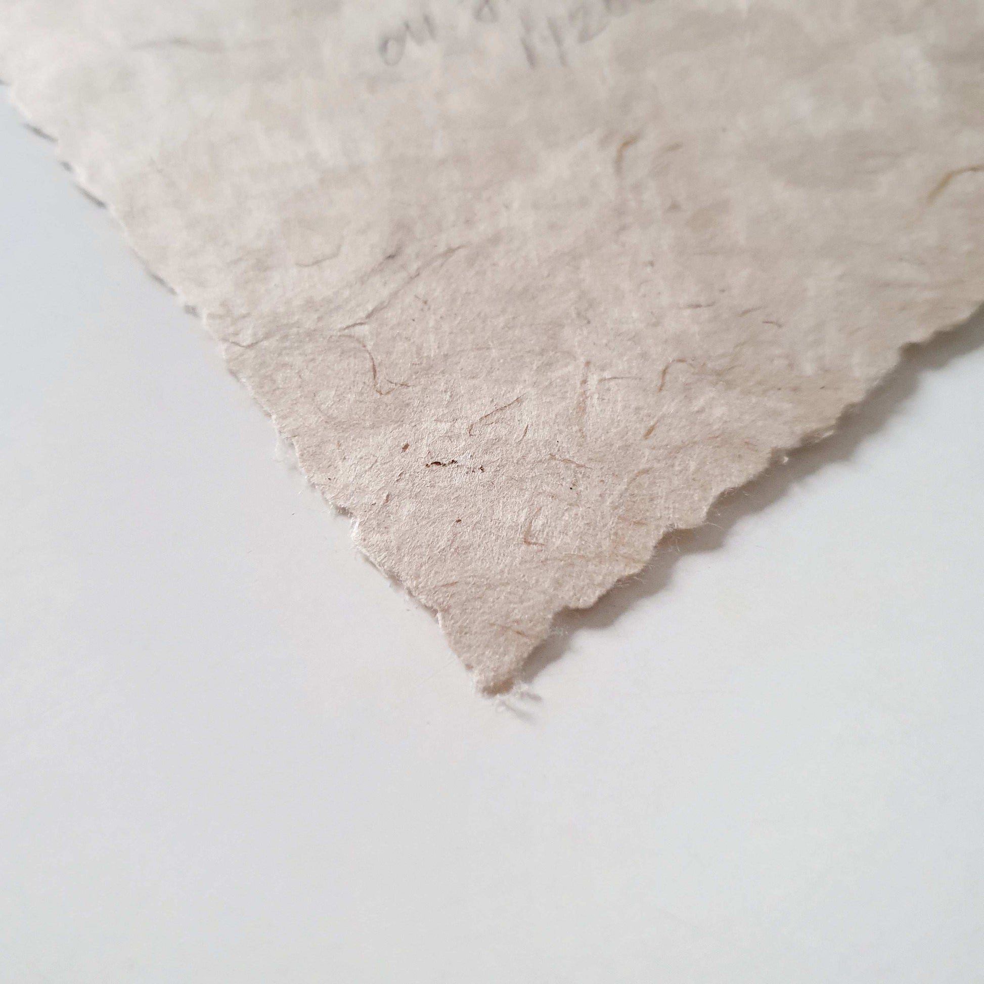 Closeup of handmade paper with deckle edge