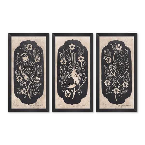 Linocut triptych of a sparrow, chickadee and starling surrounded by white flowers
