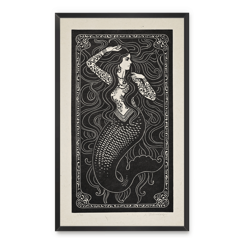 Framed artwork of a mermaid with intricate patterns on a white background