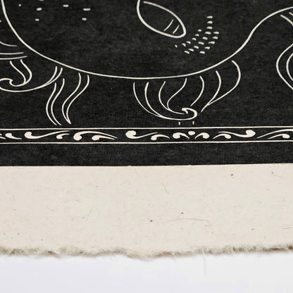 Decorative black and white patterned print on a textured surface