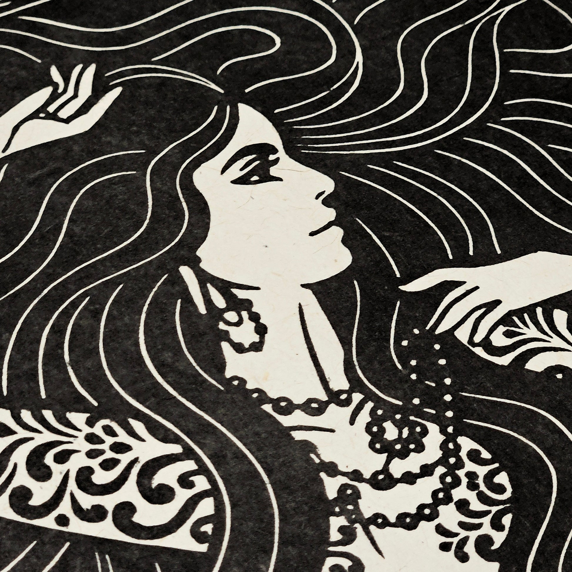 Black and white illustration of a woman with flowing hair and decorative elements.